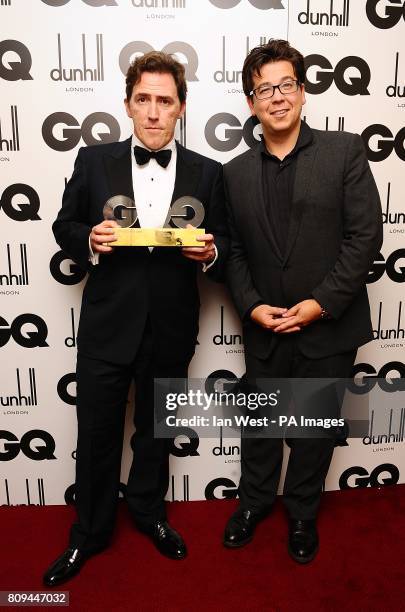 Rob Brydon with the Comedian of the Year award, presented by Michael McIntyre, at the 2011 GQ Men of the Year Awards at the Royal Opera House, Covent...