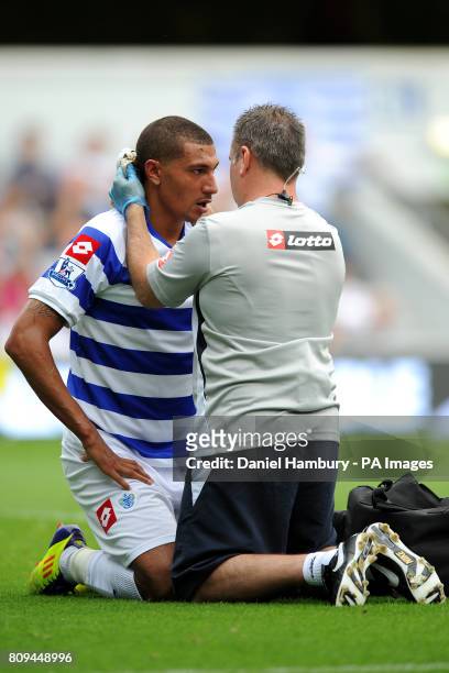 Queens Park Rangers' Jay Bothroyd receives treatment for an injury from the physio