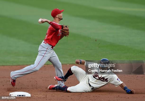 Eddie Rosario of the Minnesota Twins is out at second base as Andrelton Simmons of the Los Angeles Angels of Anaheim attempts to turns a double play...