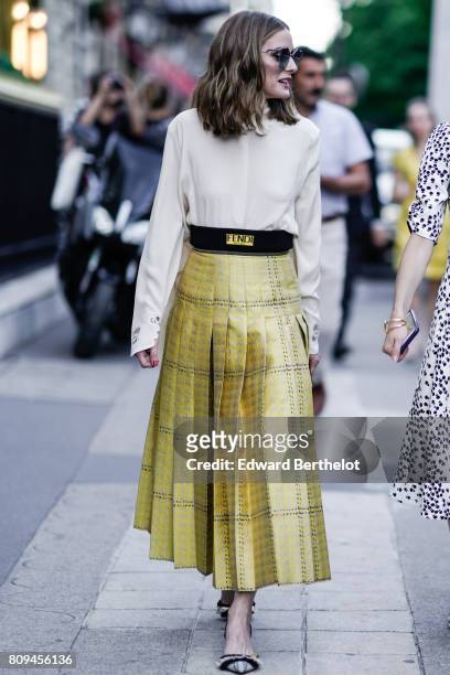Olivia Palermo wears sunglasses, a white shirt, a Fendi gold dress, heels, outside the Fendi show, during Paris Fashion Week - Haute Couture...