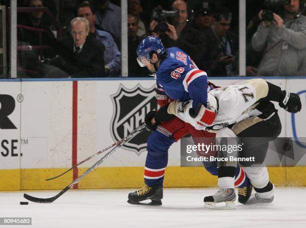 Jaromir Jagr of the New York Rangers moves around Evgeni Malkin of the Pittsburgh Penguins during game three of the Eastern Conference Semifinals of...