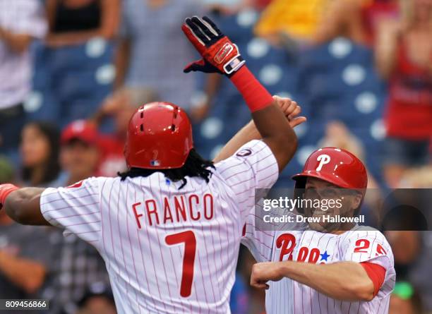 Maikel Franco and Daniel Nava of the Philadelphia Phillies celebrate Franco's two-run home run in the first inning against the Pittsburgh Pirates at...