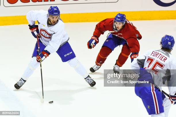 Montreal Canadiens Rookie left wing Jordan Boucher trying to keep the puck in the offensive zone before Montreal Canadiens Rookie right wing William...