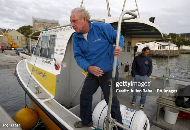 George David, skipper and owner of the Rambler 100, alights from a boat in Baltimore, west Cork, where twenty-one people on board the US-registered...