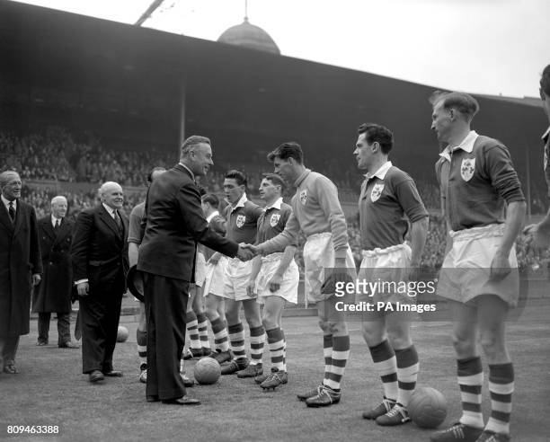 Admiral of the Fleet Earl Mountbatten of Burma shakes hands with Ireland goalkeeper Alan Kelly ahead of the match. England went on to win the game...