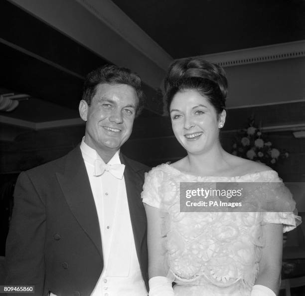 American actor Cliff Robertson, who plays Lieutenant John F Kennedy in his new film PT 109, is seen here with Miss Penny Graham as they attend the...