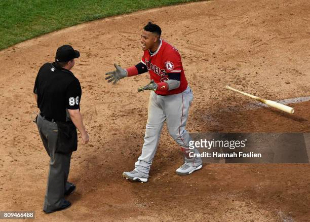 Yunel Escobar of the Los Angeles Angels of Anaheim reacts to being ejected from the game by home plate umpire Doug Eddings during the sixth inning of...