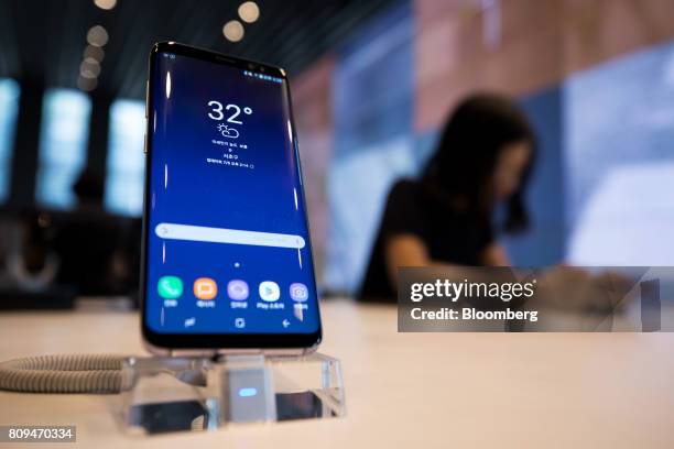 Samsung Electronics Co. Galaxy S8 smartphone stands on display at the company's D'light flagship store in Seoul, South Korea, on Wednesday, July 5,...