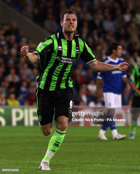 Brighton and Hove Albion's Ashley Barnes celebrates scoring his sides second goal during the npower Championship match at Cardiff City Stadium,...