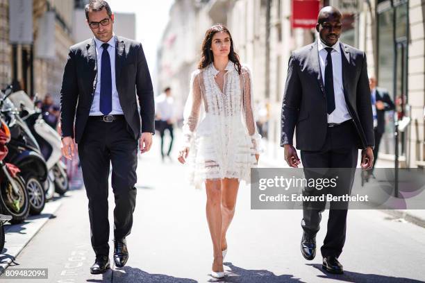 Sara Sampaio wears a white lace dress, outside the Elie Saab show, during Paris Fashion Week - Haute Couture Fall/Winter 2017-2018, on July 5, 2017...