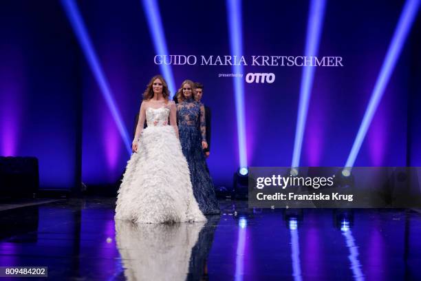 Model Charlott Cordes walks the runway at the Guido Maria Kretschmer Fashion Show Autumn/Winter 2017 presented by OTTO at Tempodrom on July 5, 2017...