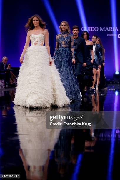 Model Charlott Cordes walks the runway at the Guido Maria Kretschmer Fashion Show Autumn/Winter 2017 presented by OTTO at Tempodrom on July 5, 2017...