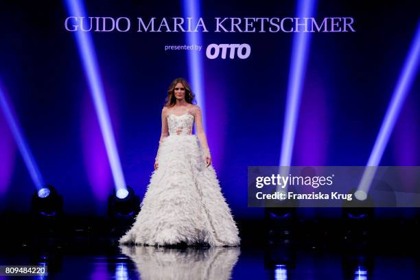 Model Charlott Cordes walks the runway at the Guido Maria Kretschmer Fashion Show Autumn/Winter 2017 presented by OTTO at Tempodrom on July 5, 2017...