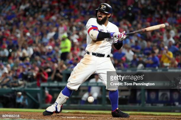 Rougned Odor of the Texas Rangers reacts after being hit by a pitch in the bottom of the fifth inning against the Boston Red Sox at Globe Life Park...