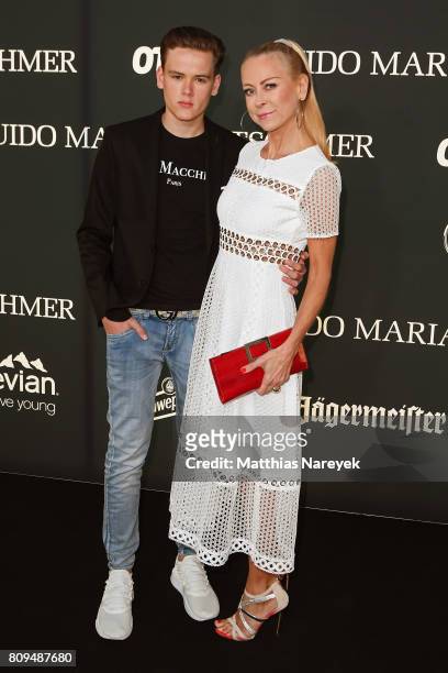 Jenny Elvers and her son Paul Jolig attend the Guido Maria Kretschmer Fashion Show Autumn/Winter 2017 at Tempodrom on July 5, 2017 in Berlin, Germany.