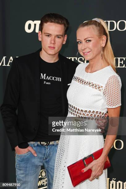 Jenny Elvers and her son Paul Jolig attend the Guido Maria Kretschmer Fashion Show Autumn/Winter 2017 at Tempodrom on July 5, 2017 in Berlin, Germany.