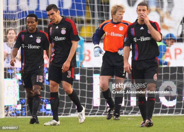 Oliver Kahn of Bayern Munich and hist team mates Ze Roberto , Lucio and Martin Demichelis look dejected after receiving the second goal during the...