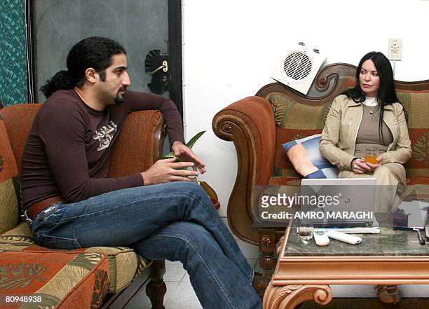 Omar bin Laden, son of Osama bin Ladan, sits with his wife Zaina al-Sabah at his apartment in Al-Rahad city near Cairo on Jan 29, 2008. Omar bin...