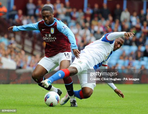 Aston Villa's Charles N'Zogbia and Blackburn's David Hoilett battle for the ball during the Barclays Premier League match at Villa Park, Birmingham.