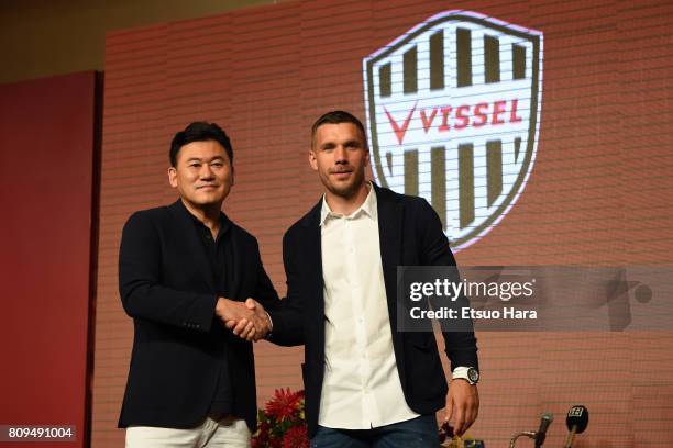 Vissel Kobe new player Lukas Podolski and Rakuten CEO Hiroshi Mikitani shake hands during a press conference on July 6, 2017 in Kobe, Hyogo, Japan.