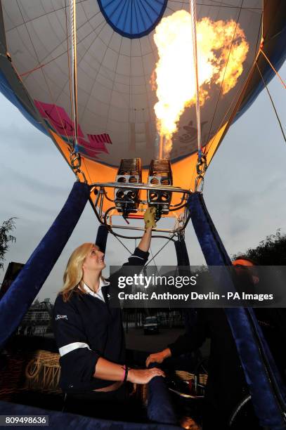 Olympic swimmer Rebecca Adlington fires the burner during a photocall to launch the National Lottery London 2012 Games hot air balloon at the Tate...