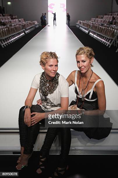 Designers of sass & Bide Sarah Jane Clarke and Heidi Middleton pose backstage prior to the S&B Vie By Sass & Bide show on the fourth day of Rosemount...