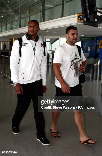 England Rugby team's Courtney Lawes and Nick Easter walk to the plane in Terminal 1 at Heathrow Airport, London.