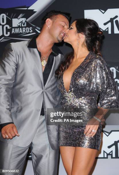 Jenni 'JWoWW' Farley and Roger Mathews backstage at the MTV Video Music Awards 2011 at Nokia Theatre L.A. LIVE in Los Angeles, USA.