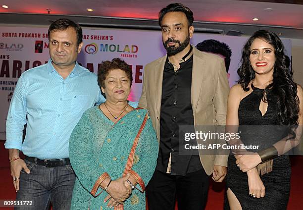 Indian Bollywood choreographers Saroj Khan , Punjabi singer Babbu Maan and actress Shweta Khanduri pose for a photograph during a promotional event...