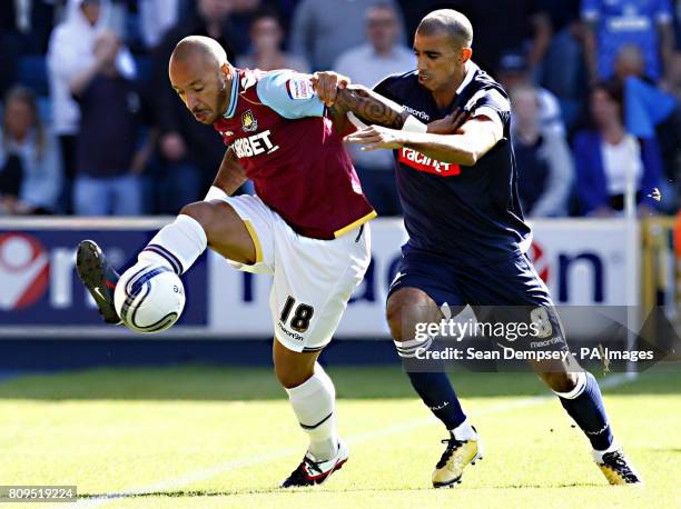 West Ham's Julien Faubert in action with Millwall's Hamer Bouazza during the npower Football League Championship match at the Den, London.