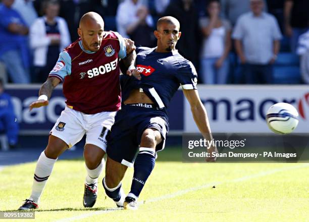 West Ham's Julien Faubert in action with Millwall's Hamer Bouazza during the npower Football League Championship match at the Den, London.