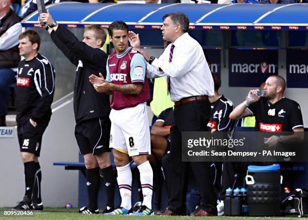 West Ham's manager Sam Allardyce makes substitutions during the npower Football League Championship match at the Den, London.