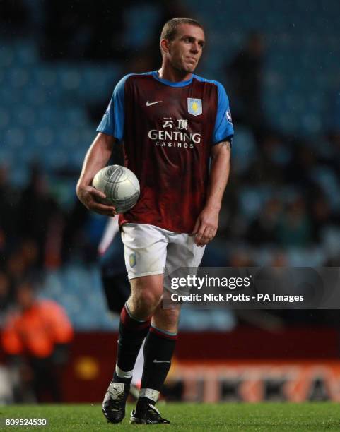 Aston Villa's Richard Dunne shows his dejection on the final whistle following their 2-0 defeat to Bolton Wanderers during the Carling Cup, Third...