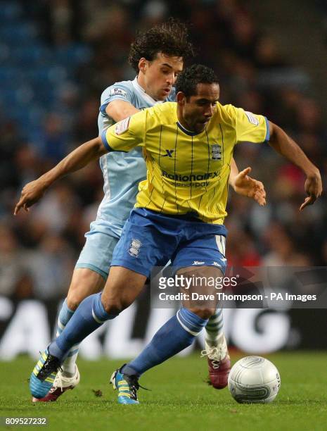 Manchester City's Owen Hargreaves tackles Birmingham City's Jean Beausejour during the Carling Cup, Third Round match at the Etihad Stadium,...
