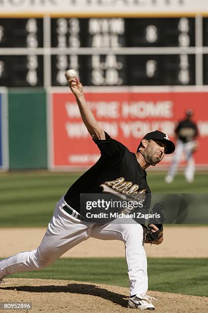 Andrew Brown of the Oakland Athletics pitches during the game against the Cleveland Indians at the McAfee Coliseum in Oakland, California on April 5,...