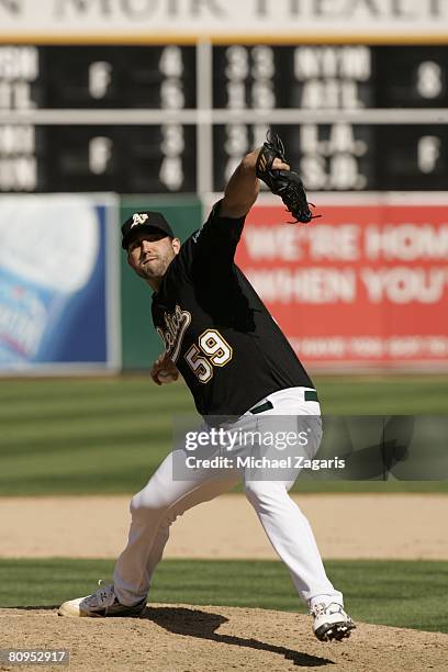 Andrew Brown of the Oakland Athletics pitches during the game against the Cleveland Indians at the McAfee Coliseum in Oakland, California on April 5,...