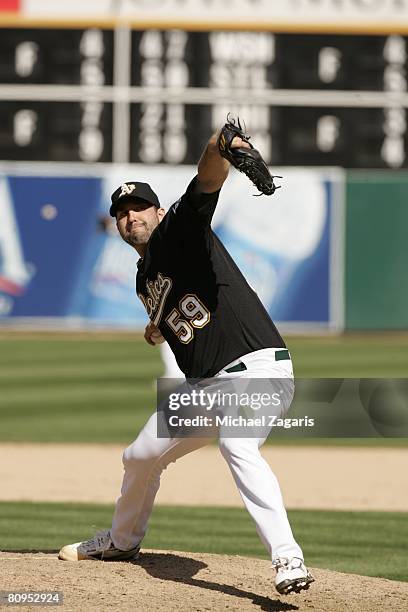 Andrew Brown of the Oakland Athletics pitches during the game against the Cleveland Indians at the McAfee Coliseum in Oakland, California on April 5,...