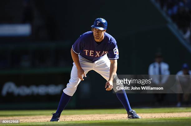 David Murphy of the Texas Rangers looks to the pitcher as he leads off first base during the game against the Toronto Blue Jays at Rangers Ballpark...