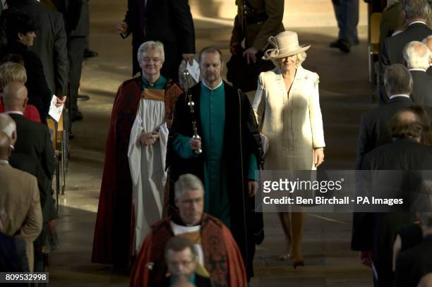 The Duchess of Cornwall joins the Dean of Salisbury the Very Reverand June Osborne and head verger Chris Simpson at Salisbury Cathedral for a DecAid...