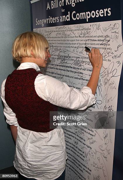 Musician Sia signs a poster at the Tribeca ASCAP Music Lounge held at the Canal Room during the 2008 Tribeca Film Festival on May 1, 2008 in New York...