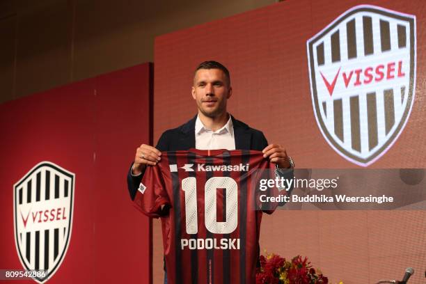 Vissel Kobe new player Lukas Podolski poses with his new jersey during a press conference on July 6, 2017 in Kobe, Hyogo, Japan.