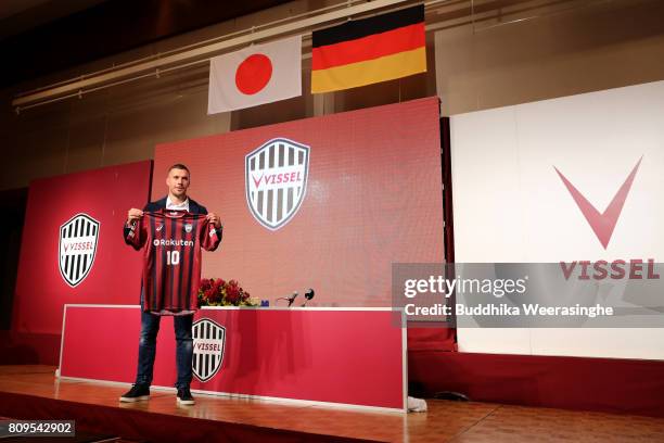 Vissel Kobe new player Lukas Podolski poses with his new jersey during a press conference on July 6, 2017 in Kobe, Hyogo, Japan.