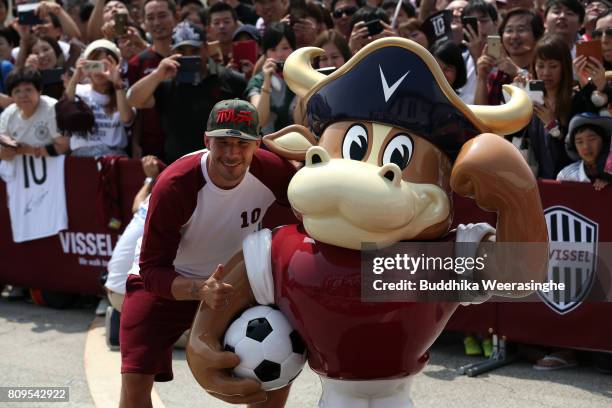 Vissel Kobe new player Lukas Podolski poses a picture with Vissel Kobe mascot Mov during the welcome ceremony at the Kobe Airport on July 6, 2017 in...