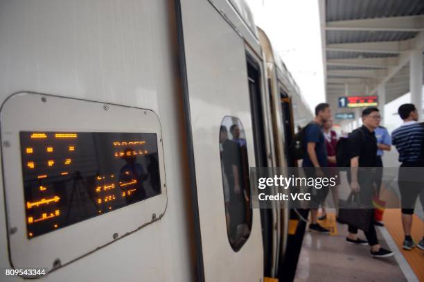 Passengers get off the first high speed train D6655 at Baiyangdian Railway Station in Xiongan New Area on July 6, 2017 in Baoding, Hebei Province of...