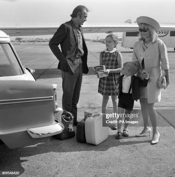 Actor Sean Connery with his actress wife Diane Cilento and their children Gigi, aged 9, and Jason, aged 4, before flying to Nice, France.