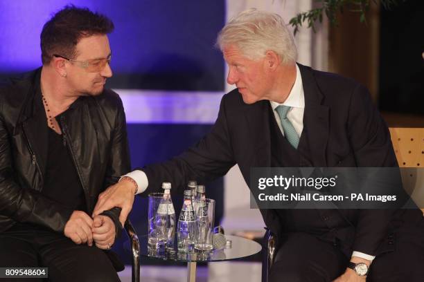 Bono talks to former US President Bill Clinton at the Global Irish Economic Forum at Dublin Castle today.