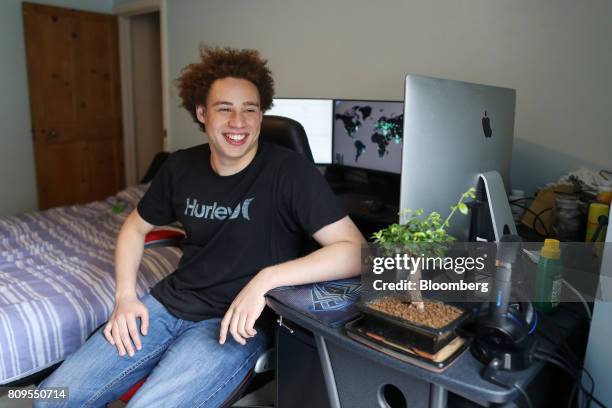 Marcus Hutchins, digital security researcher for Kryptos Logic, poses for a photograph in front of his computer in his bedroom in Ilfracombe, U.K.,...