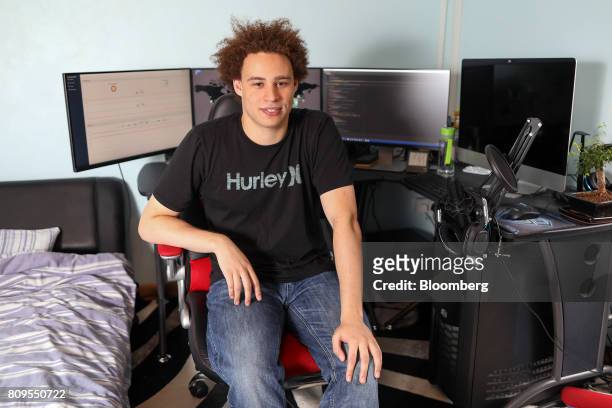 Marcus Hutchins, digital security researcher for Kryptos Logic, poses for a photograph in front of his computer in his bedroom in Ilfracombe, U.K.,...