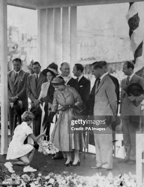 **Scanned from contact low-res** Janette Kurr gives a curtsey as she presents a golden basket to Queen Elizabeth II, on the dais outside the Town...