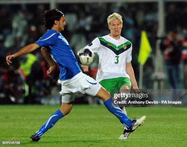 Northern Ireland's Ryan McGivern and Italy's Andrea Pirlo in action during UEFA Euro 2012 Qualifying match at the Stadio Adriatico, Pescara, Italy.